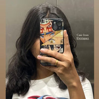 Person holding a phone with a colorful case featuring anime characters.
